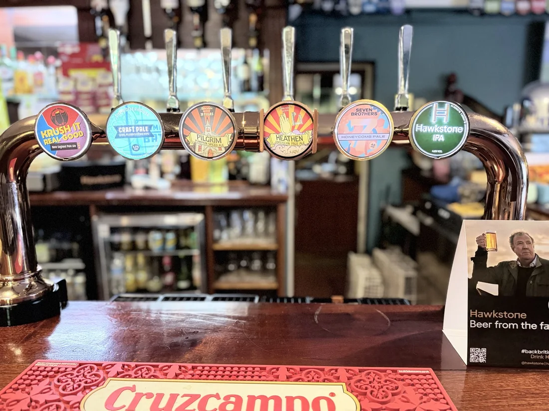 Craft beer keg taps on the bar at The OC, Mirfield